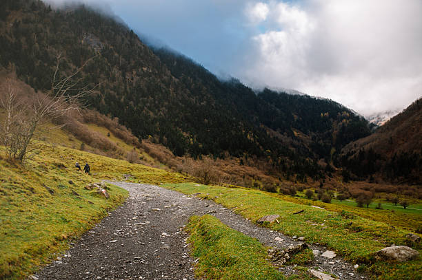 Hiking trail in a mountain area. Lac d'Ôo hiking path in Pyrenees, France.