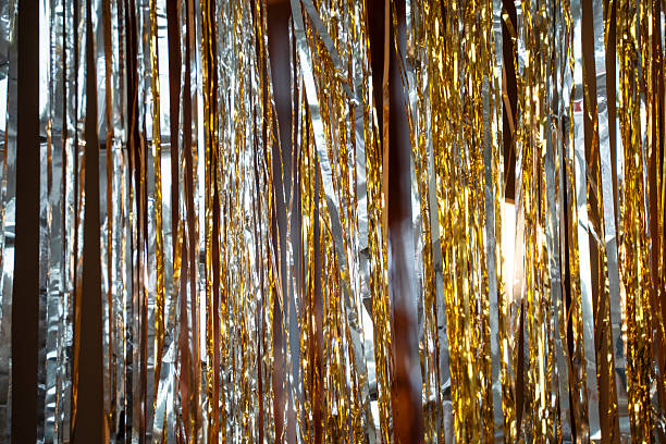 istock Holographic festive background with shiny tinsel and glitter. Gold and silver bokeh create a New Year and Christmas celebration mood. Perfect metallic, colorful holiday texture. 2248181494