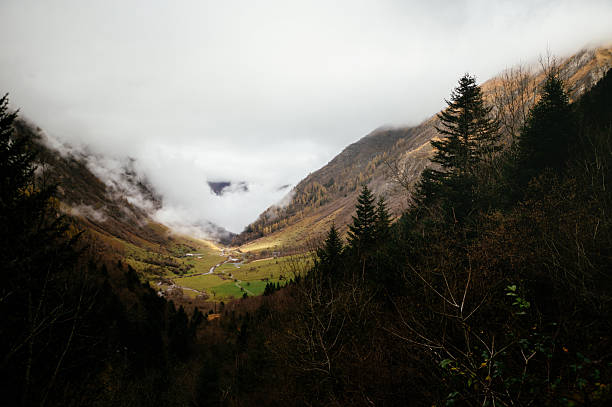 A beautiful mountain landscape with fog. Les Granges d'Astau - Lac d'Ôo in Pyrenees, France