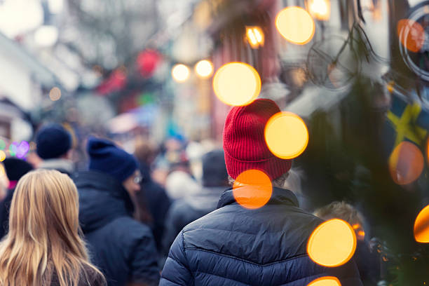 istock People visiting a christmas market 2248181694