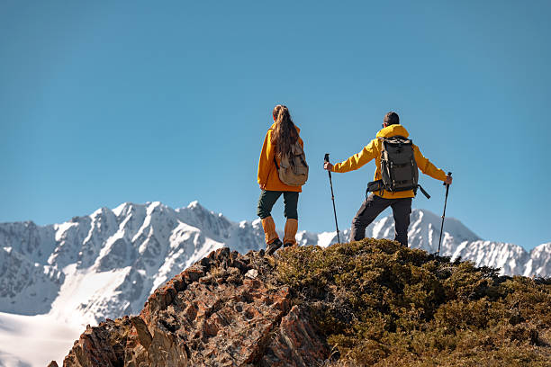 istock Two hikers or tourists on view point at white mountains 2248181835