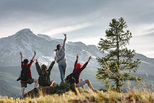 istock Group of happy hikers at sunset mountains 2248181957