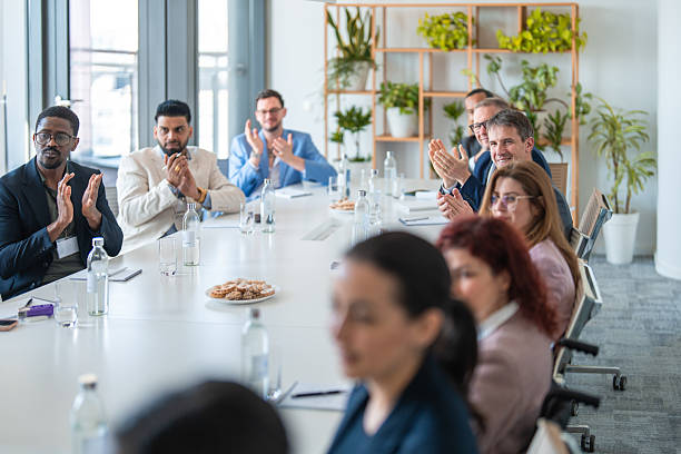 istock Diverse Business Team Applauding in Modern Office Meeting Setting 2248182258