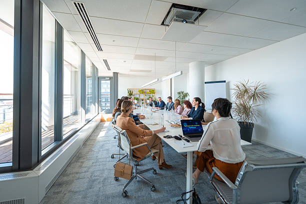 istock Diverse Business Executives Engaged in a Collaborative Meeting in a Modern Boardroom 2248182634