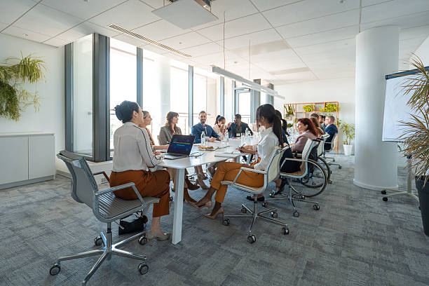 istock Diverse Business Executives in a Modern Boardroom Meeting with Collaborative Discussion 2248182635