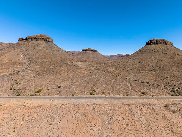 Three Sisters Mountain Peaks in the Karoo, Northern Cape Province, seen with the N1 highway between Beaufort West and Richmond.