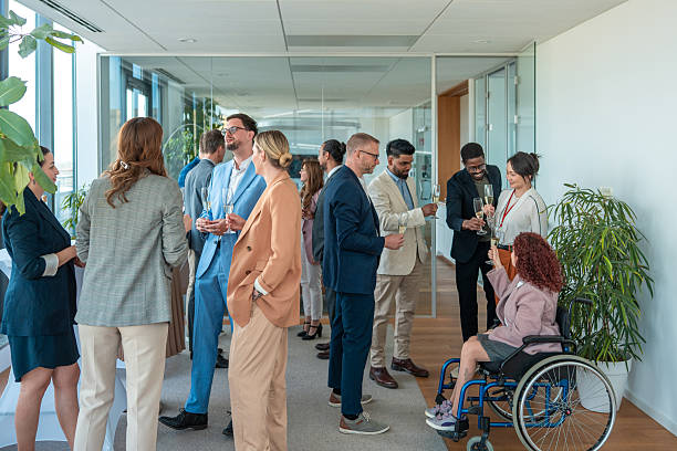 istock Professionals Enjoying a Celebratory Moment with Champagne in Office Hallway 2248183161