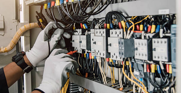 istock Electrician engineer tests electrical installations and wires on relay protection system. 2248185078