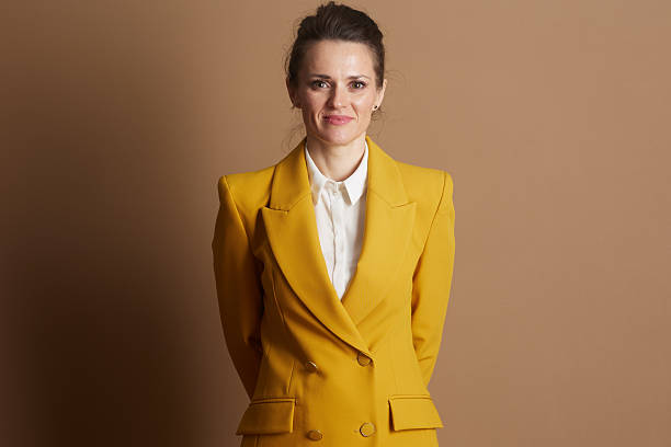 istock Confident Businesswoman in Yellow Blazer 2248186549
