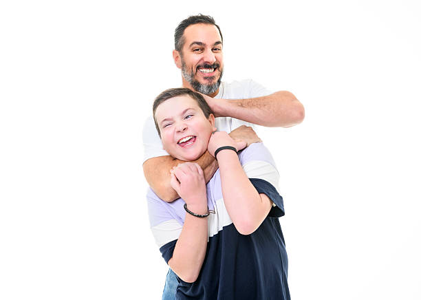 istock boy with monoparental father on studio white background 2248188201