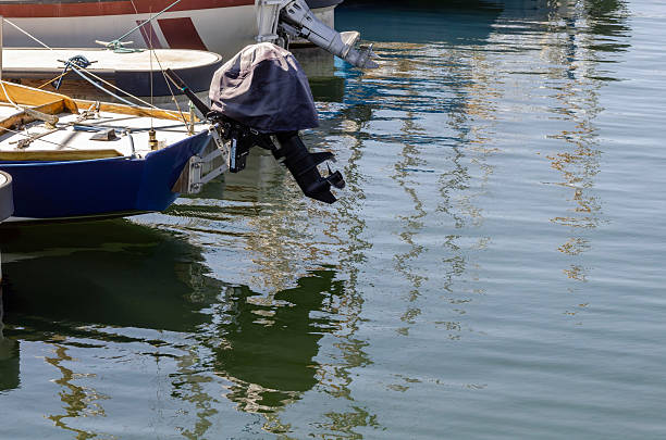 Boats and floating docks reflected in calm marina water under bright sunlight and peaceful coastal ambiance