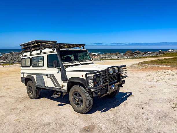 Langebaan, South Africa - November 4, 2025: Old Land Rover Defender parked on a beach
