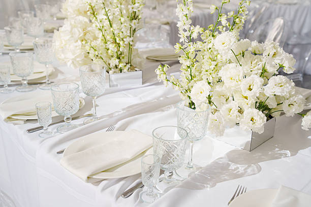 istock Elegant white flower arrangement on a banquet table setting 2248189888