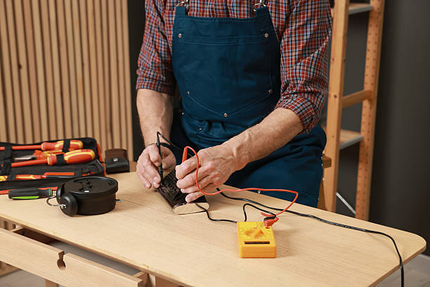 istock Relaxing hobby. Senior man testing alarm clock with multimeter in workshop, closeup 2248190008