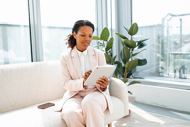 Professional woman using a digital tablet in a bright modern office