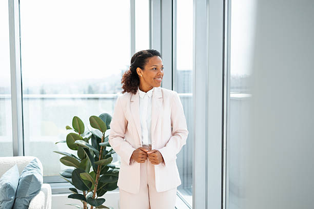 istock Professional woman in bright office looking confident and optimistic 2248190300