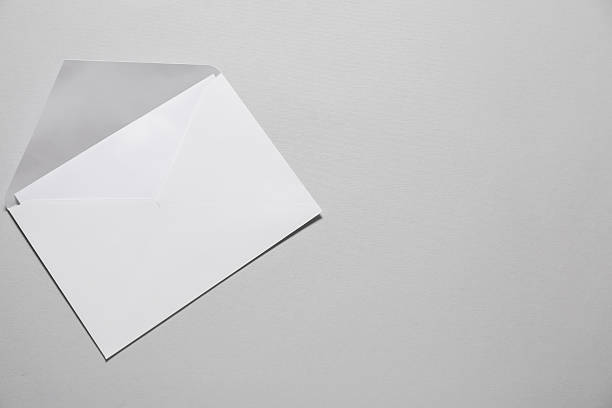 istock Paper envelope with letter on gray background, top view. Mockup for design 2248191575