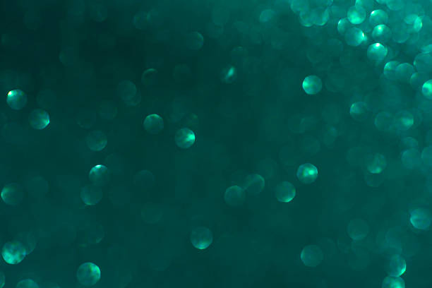 Abstract Background of Sparks in Green and Transformative Teal