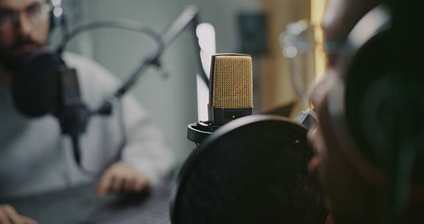 istock Professional Podcast Recording Session With Two Male, Hosts and Guest, Capturing Audio in Studio 2248195030