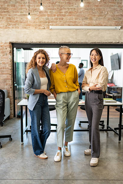 istock Diverse businesswomen team standing in modern office 2248197350