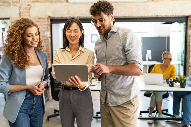 istock Diverse business people collaborating on digital tablet 2248197831