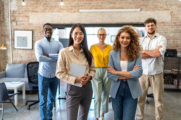 istock Diverse business team standing in modern office 2248197901