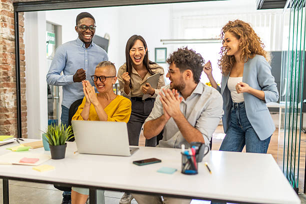 istock Diverse business team celebrating success in office 2248199127