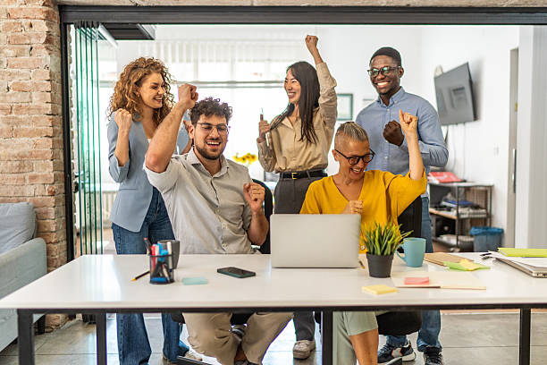 istock Diverse business team celebrating success at office 2248199144