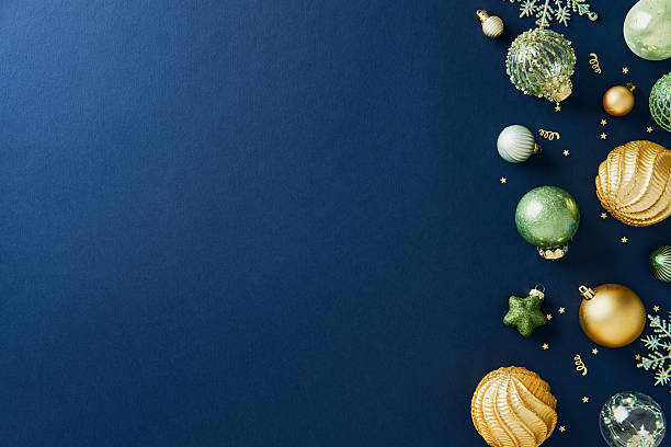 istock Elegant Christmas ornaments along the right border on a deep navy blue background. 2248203638