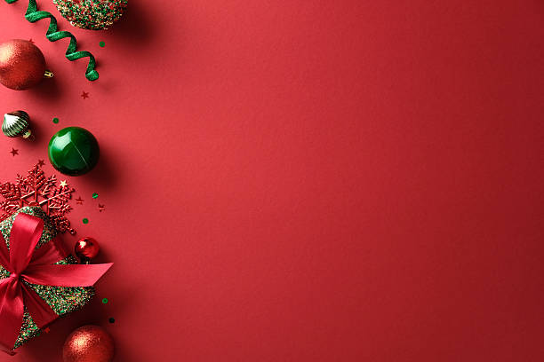 istock Christmas composition with red and green ornaments and gift in the corner. Copy space. 2248203907