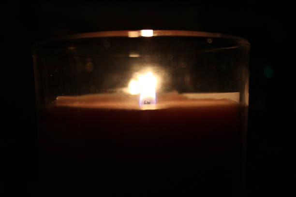 istock Soft glow of candlelight illuminating a dark room on a calm evening 2248203979