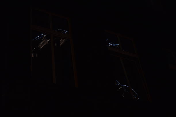 istock reflections of carousel lights in a window 2248205198