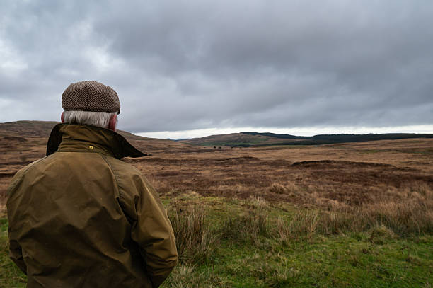 istock Farmer looking at uncultivated land in rural Scotland 2248205409