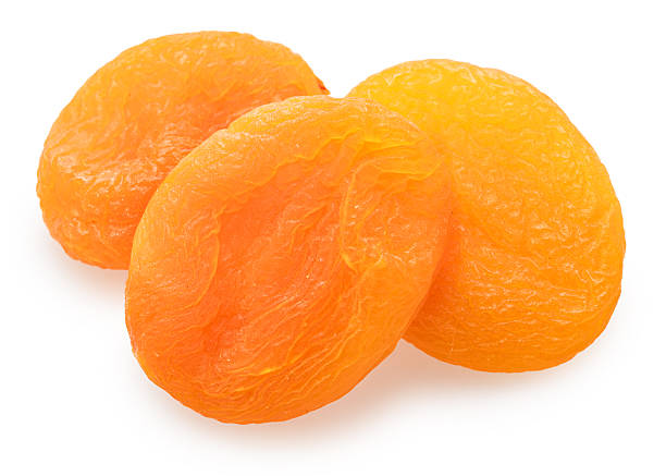 istock Dried pitted apricots isolated on white background. 2248205755