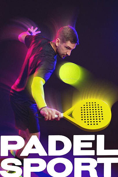 istock Padel player strikes a dynamic shot during an intense game with neon lights 2248211761