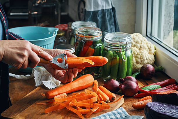 Fermented Foods - Preparing Fermented Carrots and Cauliflower with Spices Filled in a Jar