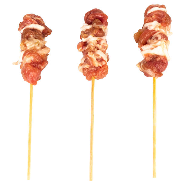 istock Fresh grilled pork on a stick isolated on white background 2248212520