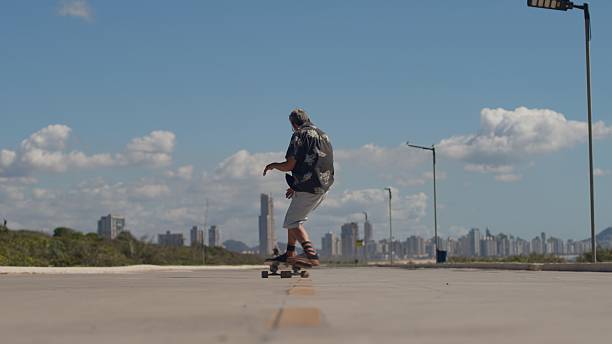 istock Senior Man Skateboarding at a Boardwalk 2248212705