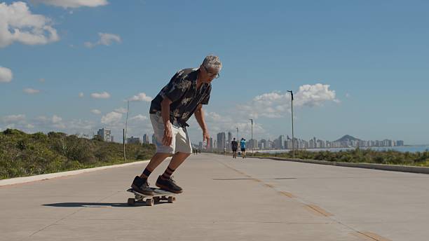 istock Senior Man Skateboarding at a Boardwalk 2248212707