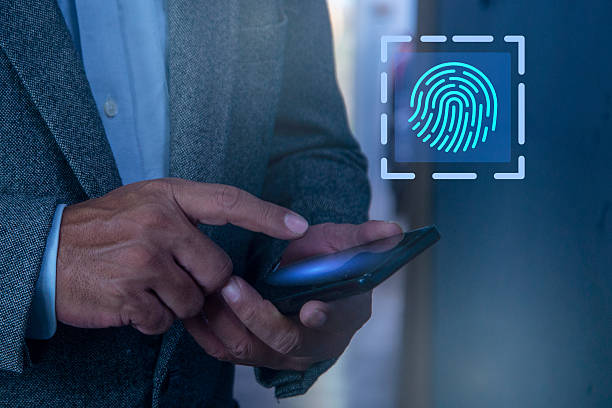 istock Man hand scanning fingerprint on smartphone screen, Unlock mobile phone, unlock the device, concept of fingerprint, biometrics, information technology and cyber security. 2248212856