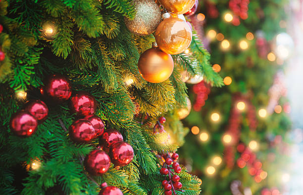 istock Festive pine tree decoration captured with a bokeh-filled background. Christmas background 2248216236