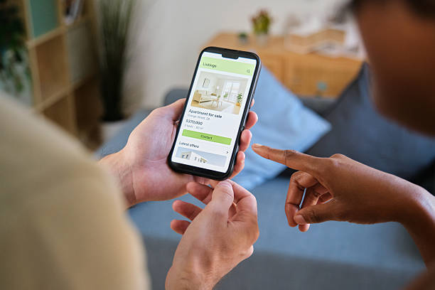 istock People browsing apartment listings on a smartphone application 2248216966