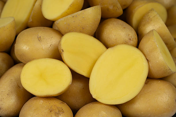 istock Fresh Raw Potatoes Cut In Half Close-Up Macro View. 2248220818