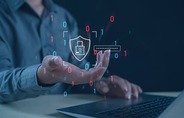 istock Businessman using laptop with holographic cybersecurity shield and password icon. Concept of data protection, online privacy, secure access, encryption, and digital technology. 2248221336
