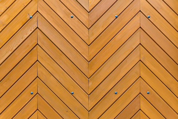 Wooden boards arranged in a herringbone pattern as a wall or door