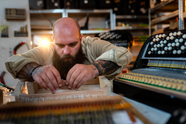 istock Craftsman is finishing his accordion 2248222585