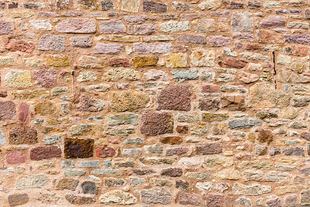 istock Wall or masonry made of colorful, geometrically arranged sandstone bricks 2248223630