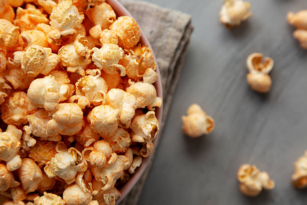 istock Homemade Cheese Popcorn in a Bowl on a gray background, top view. 2248227408