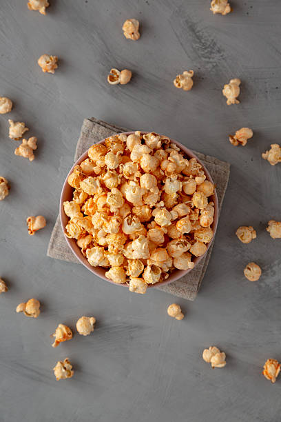 istock Homemade Cheese Popcorn in a Bowl on a gray background, top view. 2248227461