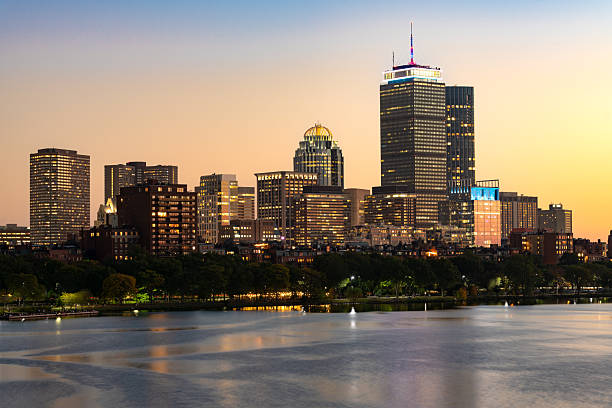 istock A stunning view of the Boston Back Bay skyline at twilight, seen across the Charles River, with illuminated high rise buildings reflecting on the water. 2248228708